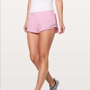 LIGHT PINK LULULEMON SHORTS
